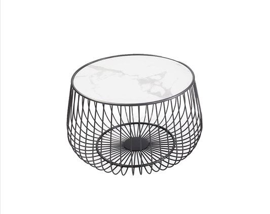 white marble top bound by a black stainless steel frame consisting of vertical metal lines running parallel to one another down to the bottom of the table where they come together in a metal circle underneath the marble