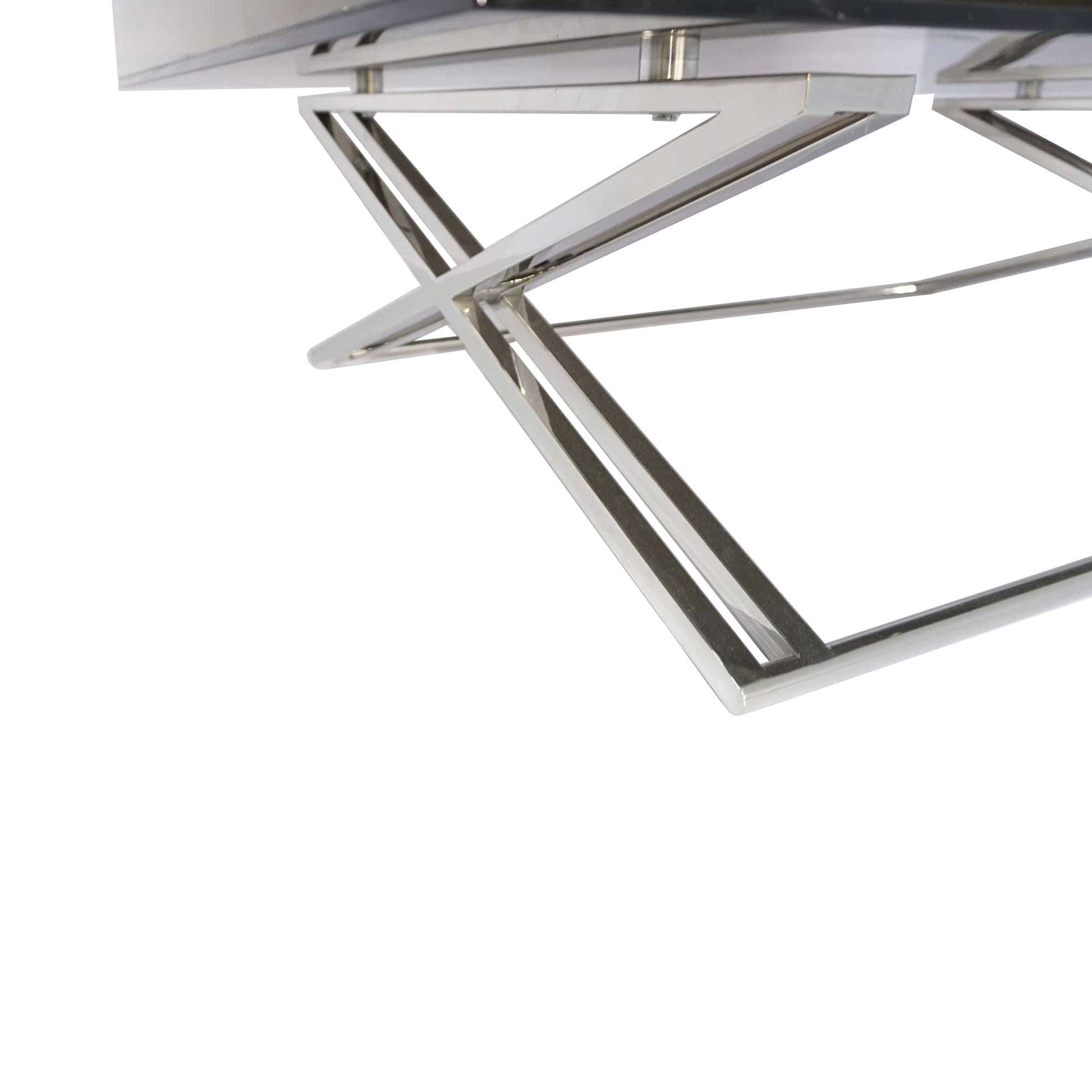 The base of the Gatsby Coffee Table is a masterpiece of modern design, featuring polished stainless steel bars that transition from singular elements and gracefully evolve into two parallel bars, intricately interwoven to form a dynamic X-shaped base. This striking foundation is anchored by a single vertical stainless steel bar at the bottom, adding stability and a touch of continuity to the overall aesthetic.